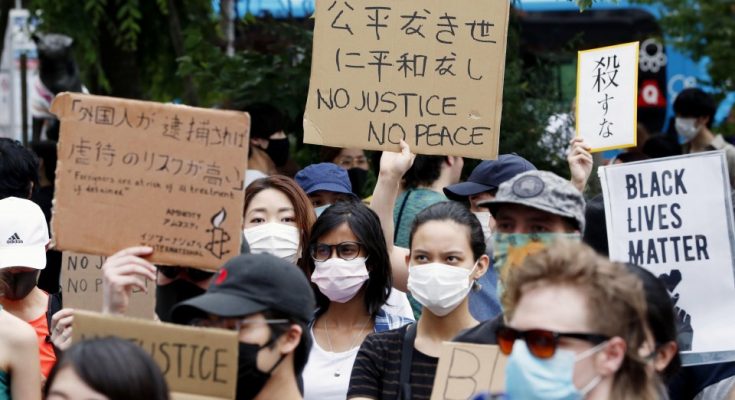 various nationalities took to the streets of central Tokyo on Saturday to protest against racial discrimination